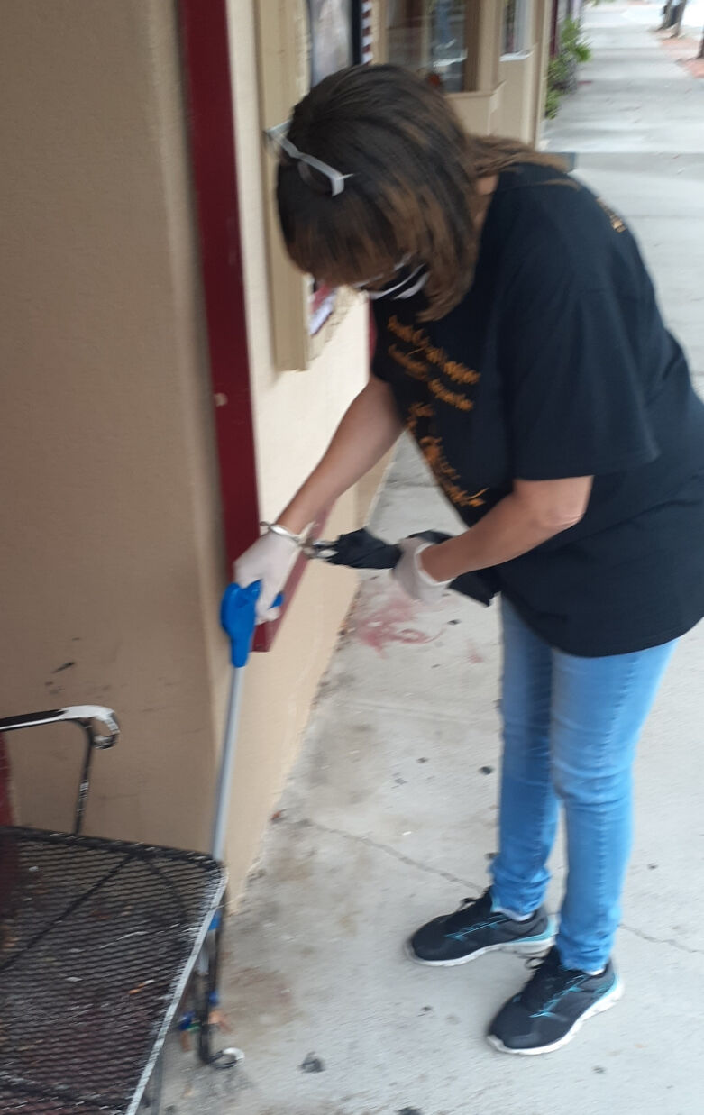 New Vision Youth members volunteer at downtown cleanup